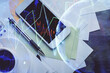 © peshkova - Multi exposure of forex graph hologram over desktop with phone. Top view. Mobile trade platform concept.
