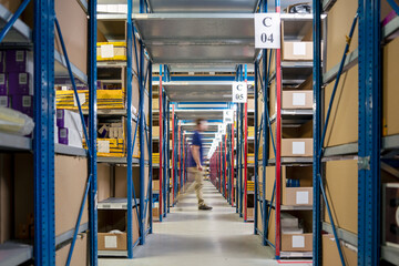 Long corridor in big warehouse full of goods