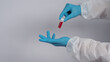 © gnepphoto - Blood tube. Covid 19 Test. doctor hand holding a blood sample tube for analysis in the lab background. Technician in medical gloves holding blood tube test for research vaccine to protect virus infect