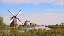 Windmills At The Undesco World Heritage Site Of Kinderdijk In Rotterdam, The Netherlands
