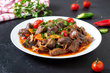 Wall Mural - Roast offal with vegetables. Armenian dish Kuchmachi.