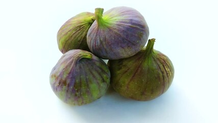 Wall Mural - Ripe fresh figs closeup on white background