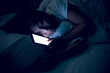 © reewungjunerr - Asian woman playing game on smartphone in the bed at night,Thailand people,Addict social media