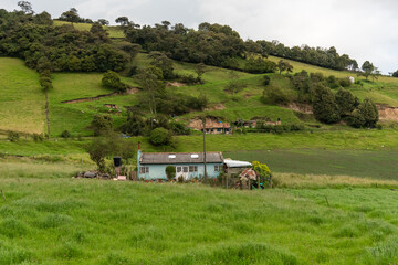 Wall Mural - Small peasant house surrounded by green landscape in the department of Boyaca. Colombia