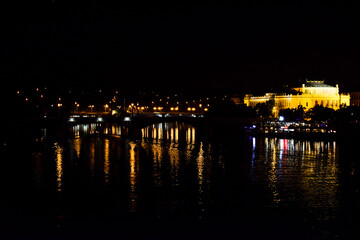 Reflection of a city on water surface in night