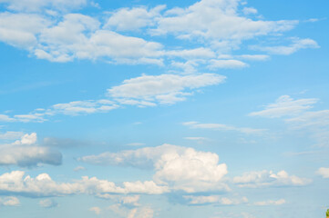 Beautiful white clouds on a clear blue sky, on a nice summer day