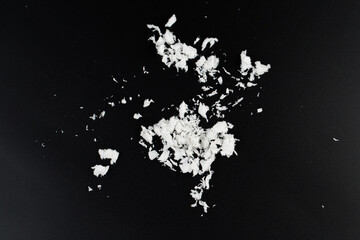 Wall Mural - white artificial synthetic snow on black background