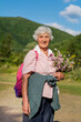 © boryanam - Happy Senior Woman on a Walk in the Summer Mountain .Tourist Woman