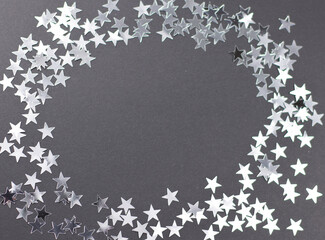 silver stars frame on black background, shining glitter sparkle card, silver stars forming a frame a