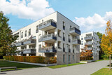 Fototapeta Londyn - Residential area with ecological and sustainable green residential buildings, low-energy houses with apartments and green courtyard