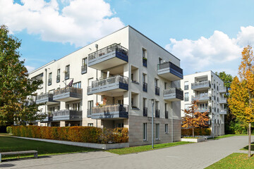 Wall Mural - Residential area with ecological and sustainable green residential buildings, low-energy houses with apartments and green courtyard