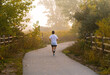 © scottshoots - A man jog on a lonely park path