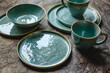 Handmade turquoise earthenware on a brown background.