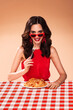 Beautiful sexy young brunette woman eating spagetti pasta. On a diet...Fashion stylish studio photo.