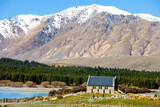 Fototapeta Na ścianę - Church and mountains in Lake Tekapo, New Zealand