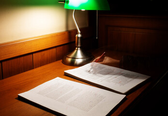 blurred proofreading paper on wooden table