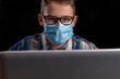 © Mitch Shark - Boy with glasses and shirt and mouth mask and laptop with text free space