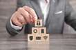 © andranik123 - Man holding wooden cube with a padlock. Network security and protection