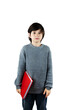 © Anna - Smiling schoolboy in grey pullover holding red book in his hands. An interest in knowledge. Isolated on white background.