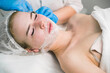 © Evgeniia - PRP therapy in beauty clinic. Cosmetologist doing injections of blood plasma to womans face to cure problem skin, closeup side view. Treatment of skin in cosmetology for young female.