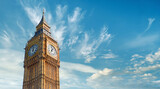Fototapeta Londyn - Big Ben Clock Tower in London, UK, on a bright day. Panoramic composition withcopy-space, text space on blue sky with feather clouds.