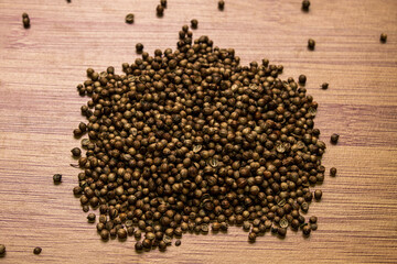 Seed coriander on a wooden background. View from above. Seasonings for meat and tea..