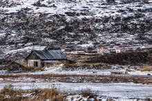 Hunting Abandoned Lodge On An Arctic Snow-covered Hill. Old Authentic Village Of Teriberka. Kola Peninsula.
