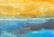 Watercolor bright blue, yellow and black background texture. Colorful liquid hand painted backdrop.