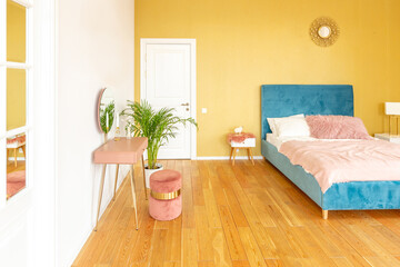 Scandinavian style apartment interior. bright yellow warm colors. wooden flooring. sunlight in large windows.