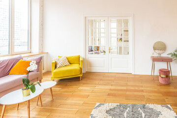 Scandinavian style apartment interior. bright yellow warm colors. wooden flooring. sunlight in large windows.