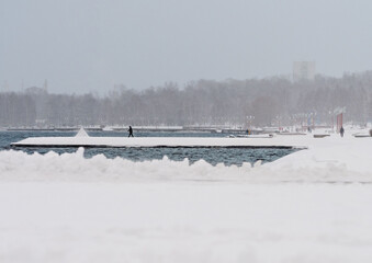 Wall Mural - City embankment in Petrozavodsk (Republic of Karelia, northwest of Russia) after a snowfall