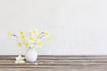 Wall Mural - narcissus in vase on wooden table