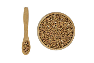 Buckwheat groats in a bowl and wooden spoon isolated on white