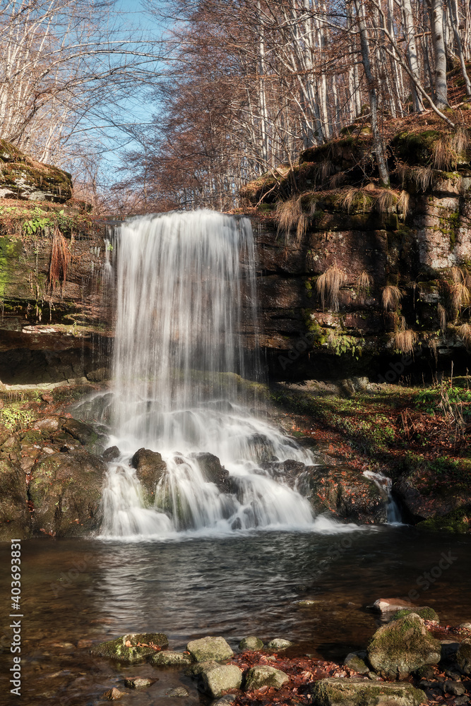 Low angle view of scenic, powerful waterfall with blurred motion water ...