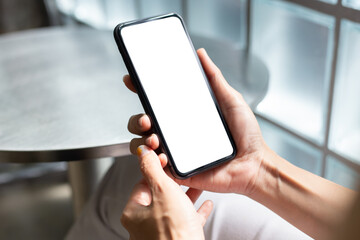 cell phone blank white screen mockup.woman hand holding texting using mobile on desk at office.background empty space for advertise.work people contact marketing business,technology