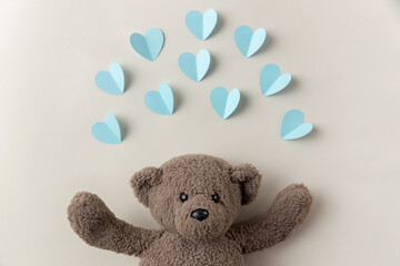 teddy bear surrounded by blue hearts, valentines day
