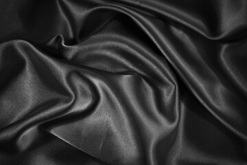 Wall Mural - Black shiny fabric background. Dark abstract background.