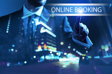 Wall Mural - Businessman using virtual screen for online booking at night