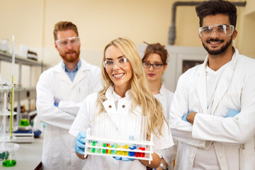 Wall Mural - Group of medical scientists working at laboratory. Science, chemistry, medicine and people concept