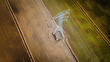 © Jemang - National Electricity grid from top view with Abstract. Aerial view of power line pylon in open paddy field.