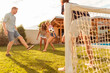 © Impact Photography - Young business team having fun on team building football competition