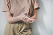© Anna Garuseva - Close Up of a Woman rubbing her hands together with disinfectant