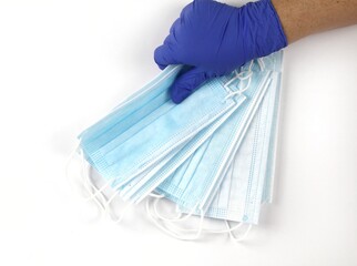 Hand on blue surgical gloves hanging Disposable masks