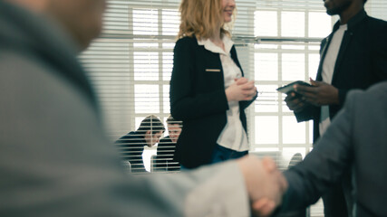 Canvas Print - close up. business partners confirm the transaction with a firm handshake