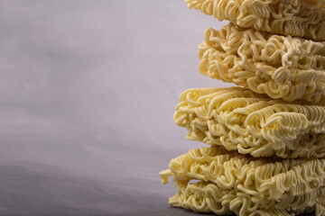 Wall Mural - dried instant noodles, isolated on gray background.