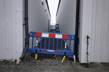 View of a Cordoned Off Alley Way on an Industrial Complex