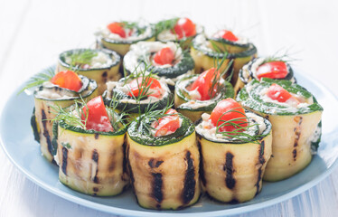 Wall Mural - Zucchini rolls with cream cheese , tomatoes and dill