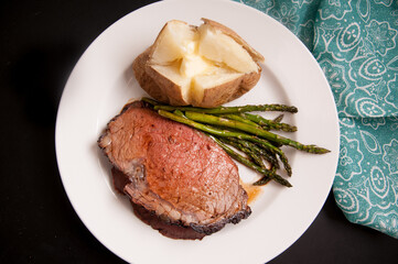 Canvas Print - prime rib dinner with potato and asparagus