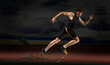 © Andrey Burmakin - Professional sprinter training at the stadium in the evening