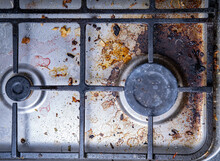 Unclean Gas Stove, Steel Kitchen Cooktop, Old Fat Stains, Fry Spots, Oil Splatters And Burned-on Bits, Top View